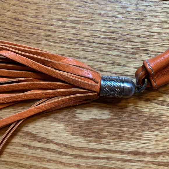 Cole Hahn orange handbag with fringe and silver hardware. - Picture 3 of 16